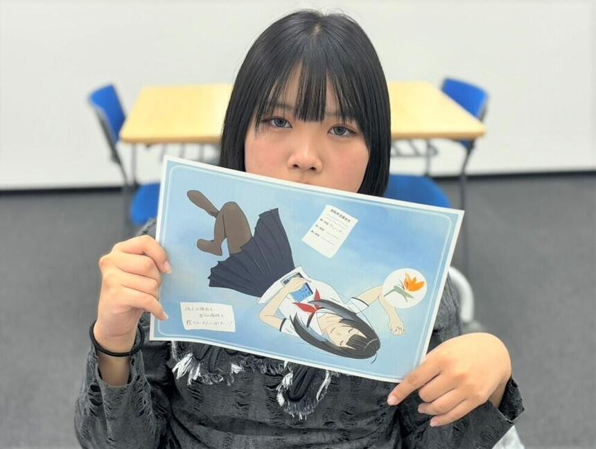 作品を持った生徒